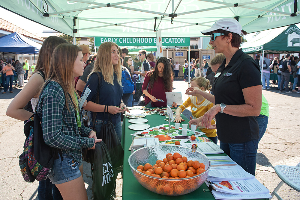 Nutrition professor Cherie Moore answers students questions at the Annual Cuesta College Promise Day.