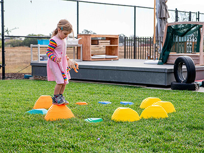 child walking on obstacle course